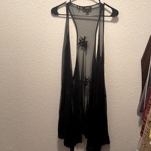 Torrid black sheer vest with black flower appliqués.